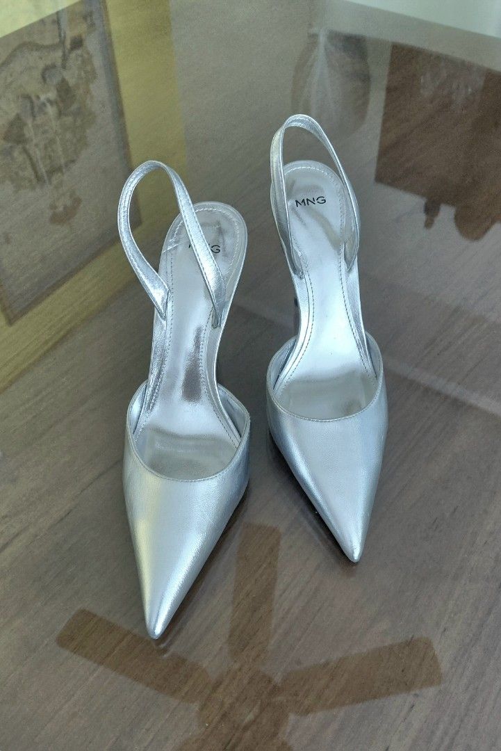 💯Mango Silver Slingback Heels Size 37 (Category: Heels) located in Mandaluyong City. Submitted by arlene2560 (Listing ID 1464399017, Image 1). Description: 💯 New, unused MANGO SILVER SLINGBACK. Size 37, fits a 38 or 9.6" insole measurements. Decluttering P1200. Mandaluyong Brand: Mango - Color: Silver - Style: Slingback Heels - Toe: Pointed - Heel: Thin - Features: Adjustable back strap - Size: 37 - Perfect for dressing up any outfit.