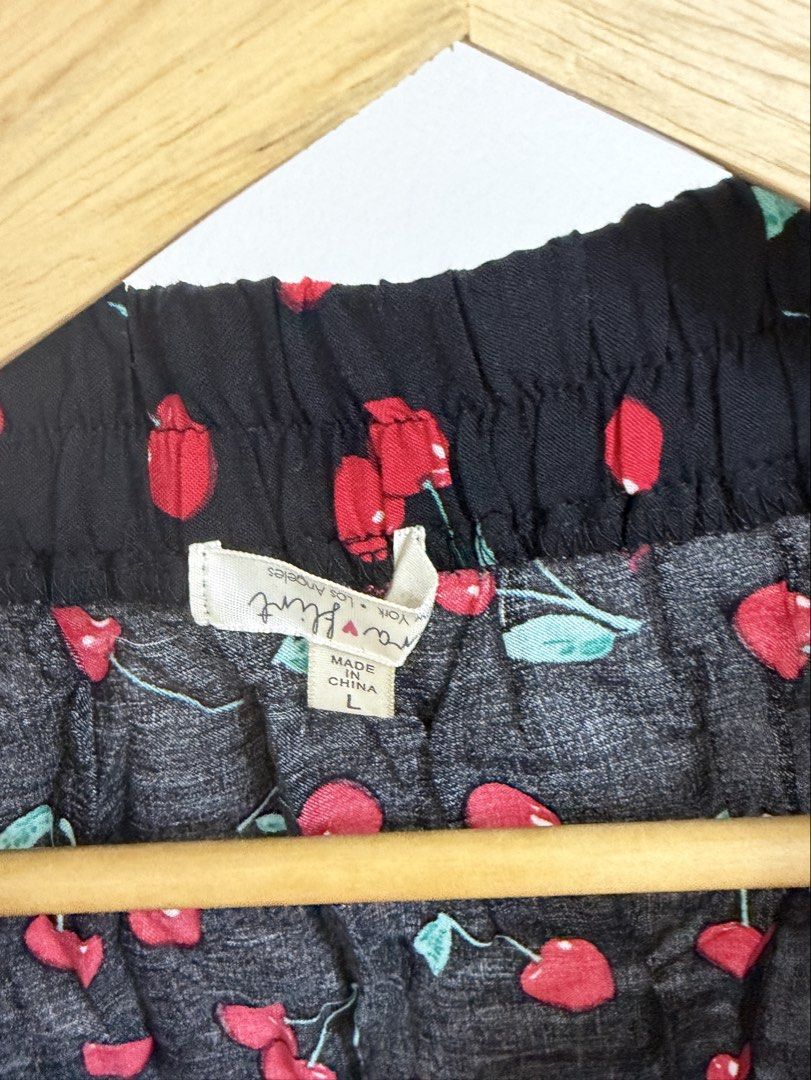 Mara Flirt Black Cherry Print Button Front Skirt Size L (Category: Skirts) located in Cebu City. Submitted by jnnwright (Listing ID 1464494896, Image 2). Description: - Adorable black skirt with a fun cherry print. - Features a stylish button front detail. - Flirty ruffle hem adds a playful touch. - Ideal for casual outfits. - Effortlessly pairs with simple tops. - Size: Large (L).