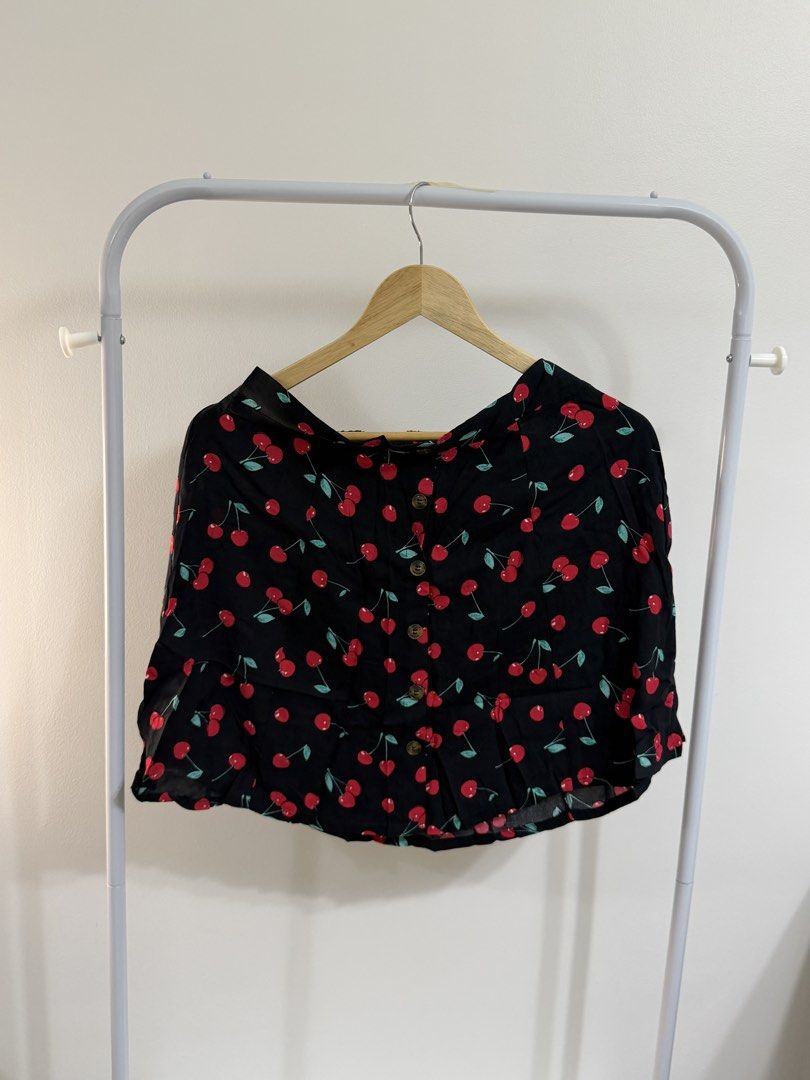 Mara Flirt Black Cherry Print Button Front Skirt Size L (Category: Skirts) located in Cebu City. Submitted by jnnwright (Listing ID 1464494896, Image 1). Description: - Adorable black skirt with a fun cherry print. - Features a stylish button front detail. - Flirty ruffle hem adds a playful touch. - Ideal for casual outfits. - Effortlessly pairs with simple tops. - Size: Large (L).