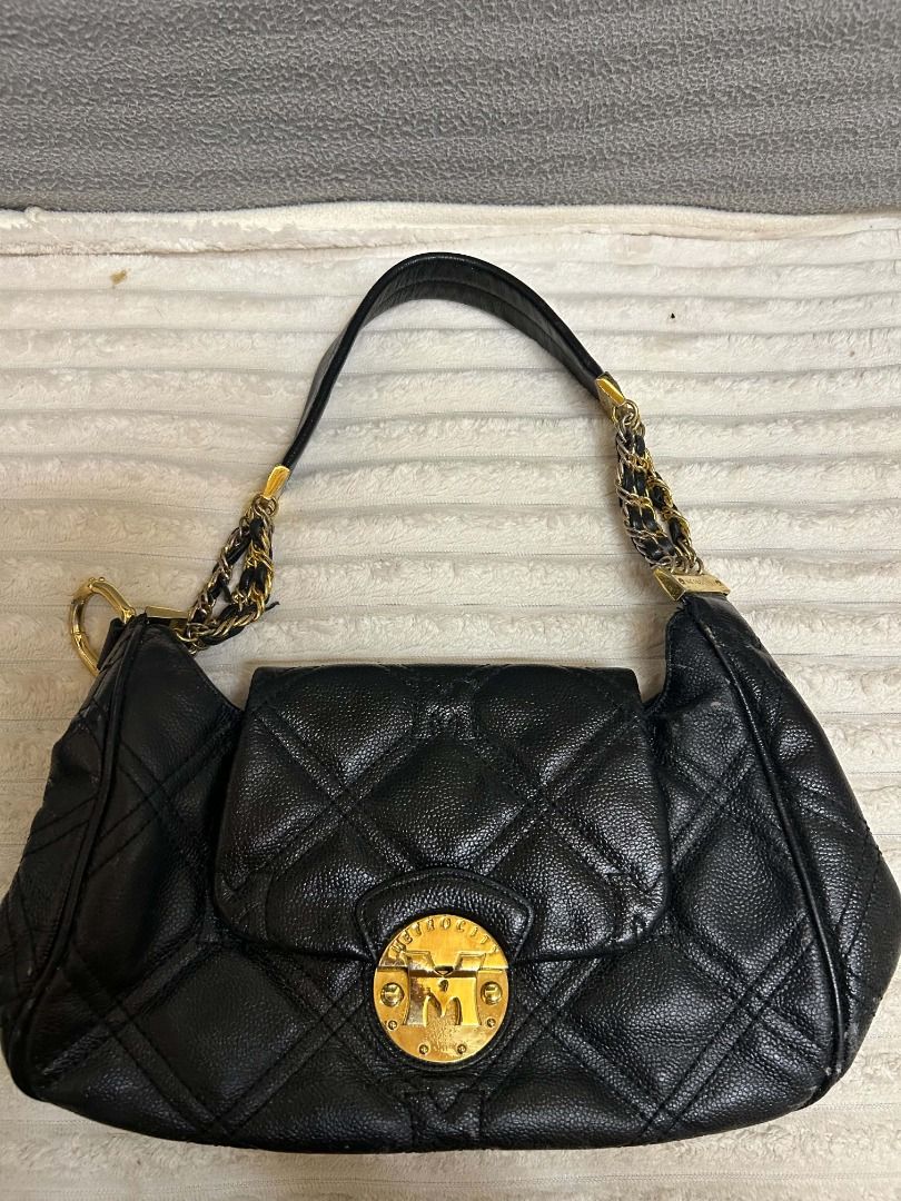 Marc by Marc Jacobs Black Quilted Leather Shoulder Bag (Category: Luxury Bags & Wallets) located in Caloocan City. Submitted by keenmoon.752ef0 (Listing ID 1464542346, Image 1). Description: - Black quilted leather shoulder bag - Gold hardware with chain detail on strap - Signature Marc by Marc Jacobs turn-lock closure - Classic and versatile for everyday wear - Ample interior space.