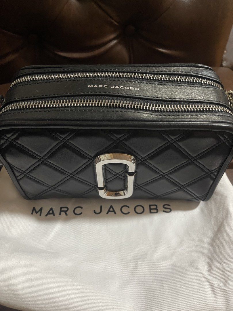 Marc Jacobs Black Quilted Leather Camera Bag (Category: Luxury Bags & Wallets) located in Malabon City. Submitted by charlize.ph (Listing ID 1464391700, Image 2). Description: - Black quilted leather camera bag by Marc Jacobs - Signature silver MJ logo hardware - Double zip closure - Detachable leather strap - Dust bag included - Ideal for everyday use.