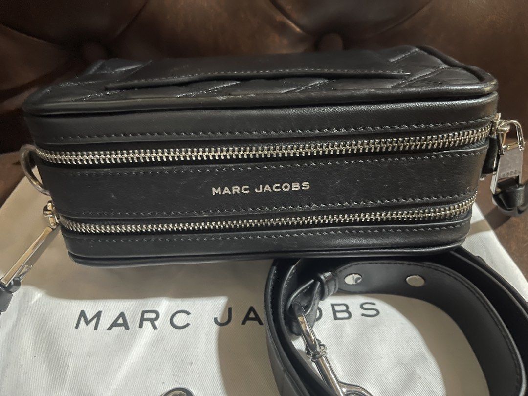 Marc Jacobs Black Quilted Leather Camera Bag (Category: Luxury Bags & Wallets) located in Malabon City. Submitted by charlize.ph (Listing ID 1464391700, Image 3). Description: - Black quilted leather camera bag by Marc Jacobs - Signature silver MJ logo hardware - Double zip closure - Detachable leather strap - Dust bag included - Ideal for everyday use.