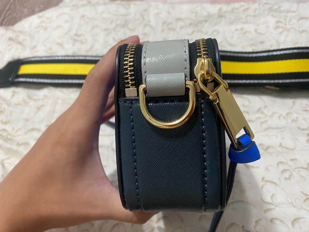 Marc Jacobs Snapshot Camera Bag Blue Yellow Strap (Category: Luxury Bags & Wallets) located in Manila. Submitted by miguelwoii (Listing ID 1464389169, Image 3). Description: - Authentic Marc Jacobs Snapshot Bag - Stunning Bright Blue Leather - Polished Gold Hardware - Comes with iconic Yellow & Black Striped Strap - Includes a Plain Blue Strap - Brand New with Tags Attached - Ideal for Everyday Style & Functionality.