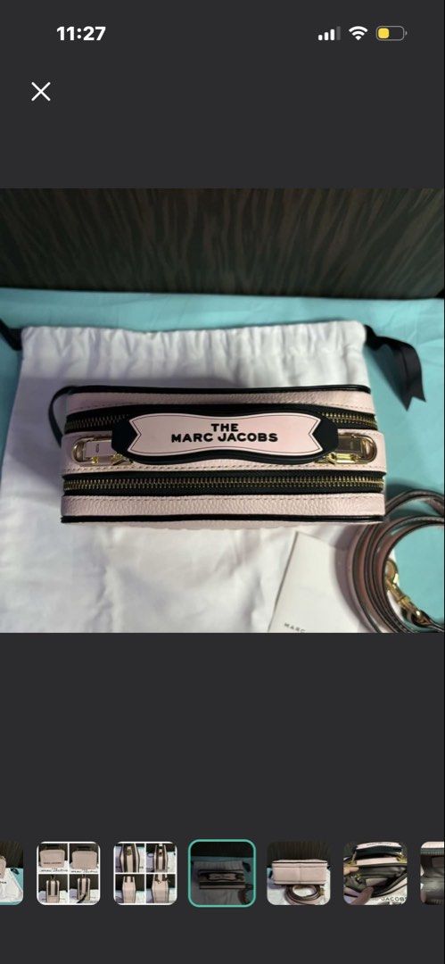 Marc Jacobs The Box Pale Pink (Category: Luxury Bags & Wallets) located in Manila. Submitted by prelovedhereee (Listing ID 1464368277, Image 3). Description: - Authentic pale pink Marc Jacobs camera bag - Made of durable pebbled leather with chic black trim - Features elegant gold hardware and zipper details - Comes with original dust bag and adjustable strap - Interior boasts multiple compartments for organized storage - Ideal for stylish everyd