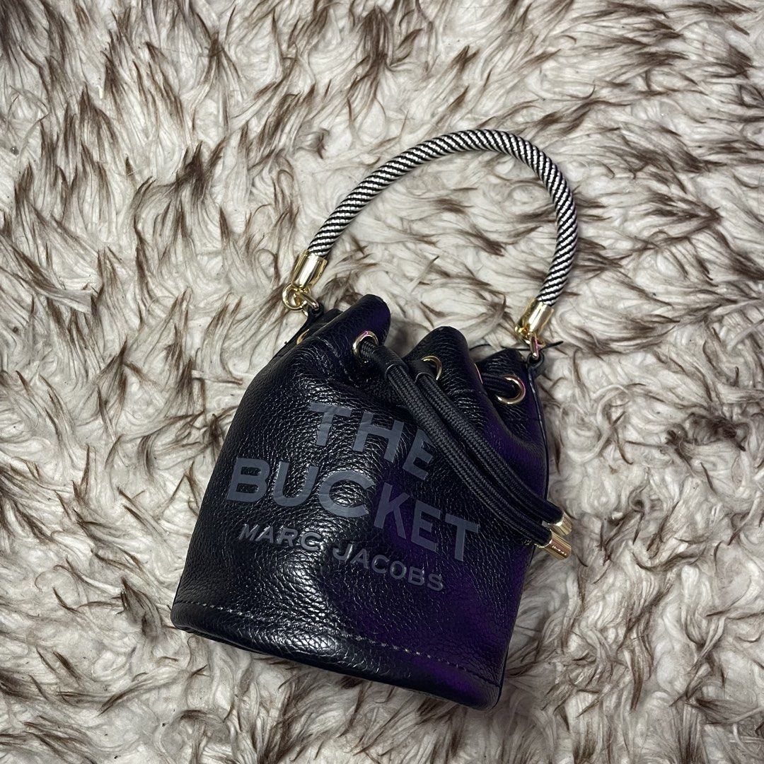 Marc Jacobs The Bucket Bag Black Leather (Category: Luxury Bags & Wallets) located in Marikina City. Submitted by nqshop (Listing ID 1464475067, Image 1). Description: - Authentic Marc Jacobs black leather bucket bag mini - Iconic 'The Bucket' logo embossed on the front - Versatile carrying options: detachable crossbody strap and top handle - Secure drawstring closure - Elegant gold hardware details - Ideal for everyday style and practicality -Wi