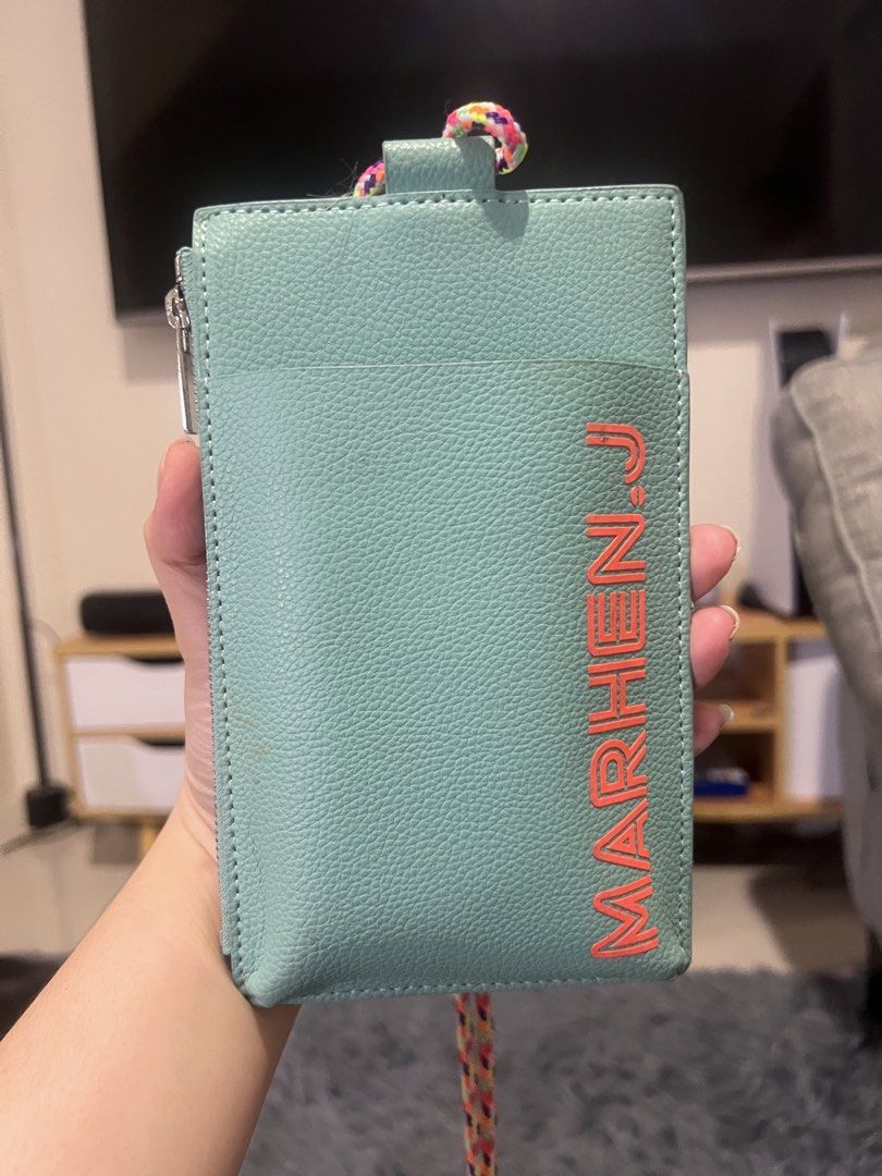 MARHEN.J Mint Green Phone Pouch with Strap (Category: Purses & Pouches) located in Cainta. Submitted by xkengkaix (Listing ID 1464488412, Image 3). Description: - Marhen.J Phone Pouch - Color: Mint Green - Made in Korea - Features a secure zip compartment - Convenient front pocket - Comes with a vibrant, colorful braided strap - Perfect for keeping your phone and essentials easily accessible.