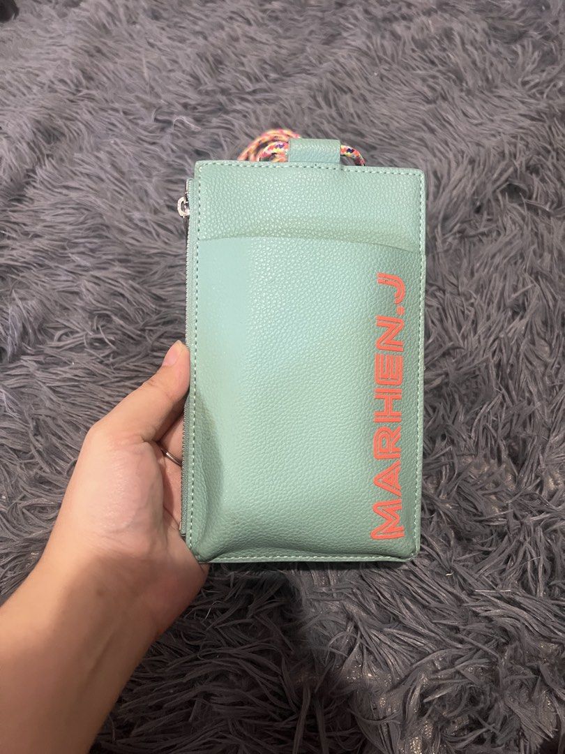 MARHEN.J Mint Green Phone Pouch with Strap (Category: Purses & Pouches) located in Cainta. Submitted by xkengkaix (Listing ID 1464488412, Image 2). Description: - Marhen.J Phone Pouch - Color: Mint Green - Made in Korea - Features a secure zip compartment - Convenient front pocket - Comes with a vibrant, colorful braided strap - Perfect for keeping your phone and essentials easily accessible.