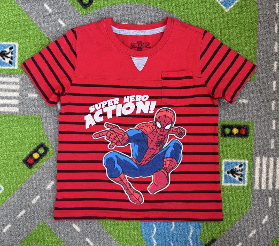 Marvel Spider-Man Striped Shirt (Category: Babies & Kids Fashion) located in Rizal. Submitted by preloovved (Listing ID 1464451841, Image 1). Description: Cool red & black striped Spider-Man tee for kids! Features a big graphic, 'Super Hero Action!' text, and a chest pocket. Soft and comfy for your little hero. Red t-shirt features a Spider-Man graphic with the words “Super Hero Action!”. It has black horizontal stripes on the sleeves and body. T
