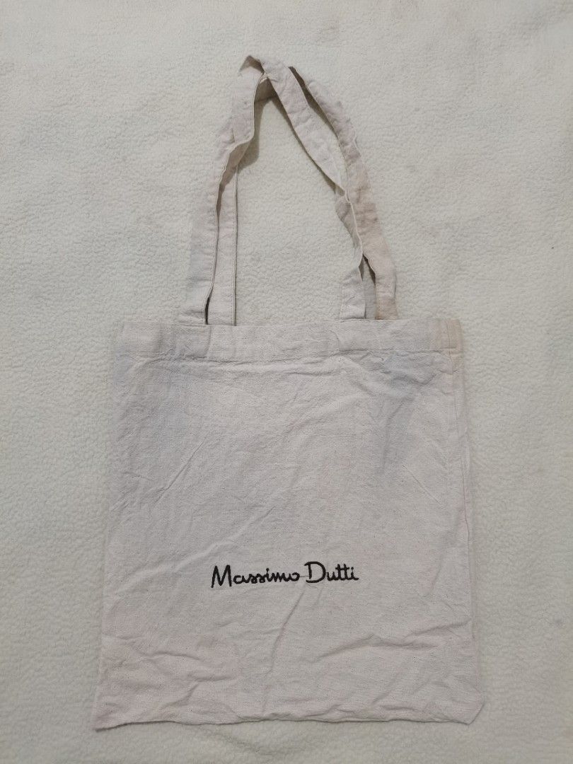 Massimo Dutti cotton tote bag (unisex) (Category: Tote Bags) located in Santa Cruz. Submitted by oddpenguin-4575 (Listing ID 1464530544, Image 2). Description: 📌.....P L E A S E R E A D..... 📌measurement:L-13" /W-12" 📌color-9/10 📌Brand:Massimo Dutti 📌issue:sign of usage 📌Actual shades may differ slightly depending on ambient lighting conditions. 📌"Thrift Disclaimer: Items are pre-owned. Expect minor flaws like washable marks or storage dus