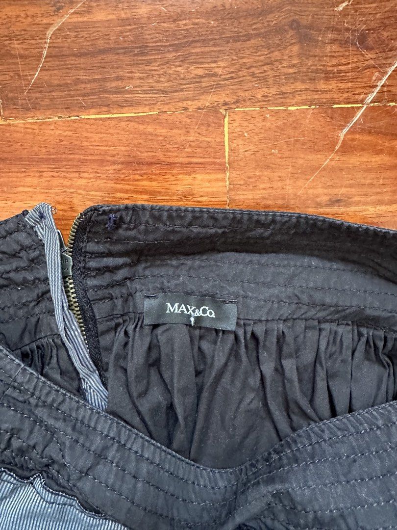 MAX&Co. Striped Pleated Skirt (Category: Skirts) located in Cainta. Submitted by buy.preloved (Listing ID 1464375425, Image 2). Description: - Max&Co. black and white pinstripe skirt - Black waistband with textured detail - All-around pleats - Includes black underskirt - Zipper closure at the back - Versatile for casual or smart casual outfits.
