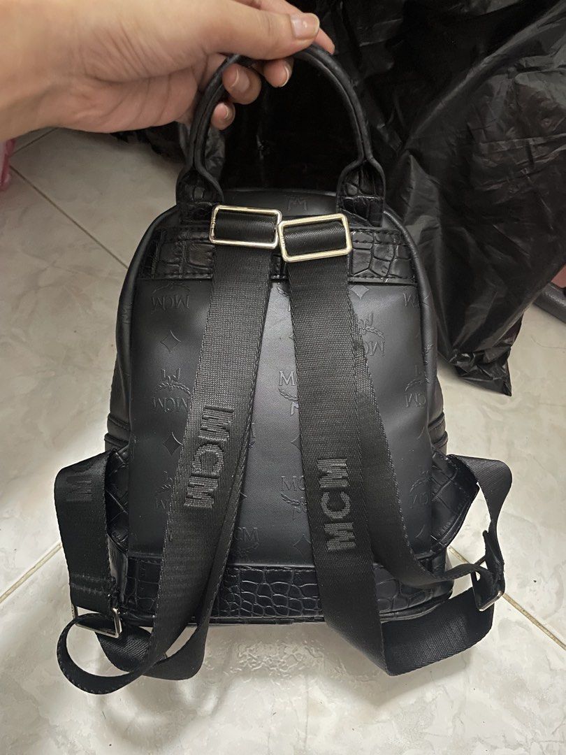MCM Studded Monogram Mini Backpack Black (Category: Luxury Bags & Wallets) located in Cagayan de Oro. Submitted by luxieebags (Listing ID 1464547742, Image 2). Description: - Authentic MCM mini backpack - All-over signature monogram print - Elegant gold stud detailing - Convenient front zip pocket - Spacious main compartment - Adjustable shoulder straps for comfort - Ideal for everyday errands or travel adventures.