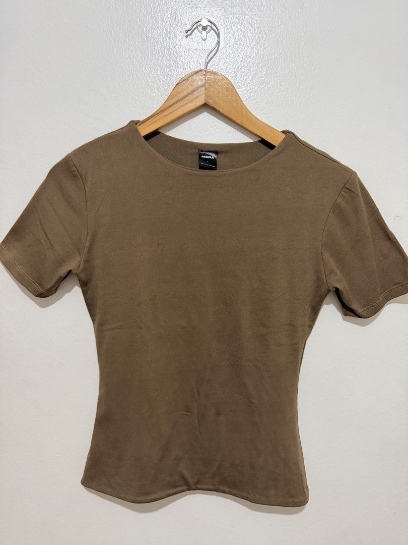 MERA Brown Turtle Neck Double Lining Top (Category: Shirts) located in Caloocan City. Submitted by ashpreloves (Listing ID 1464380791, Image 1). Description: - Basic brown short sleeve tee - Brand: MERA - Simple and versatile for everyday wear - Snug fit - Measurements available upon request.