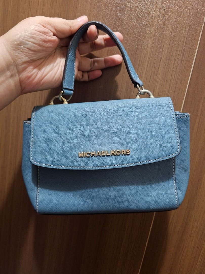 Michael Kors Mini 2way bag (Category: Shoulder Bags) located in Manila. Submitted by shopaholicmimi (Listing ID 1464476391, Image 1). Description: preloved and in good condition saffiano rare, not legacy, vintage, coach, ergo, laurel, carly, zoe, soho, y2k.