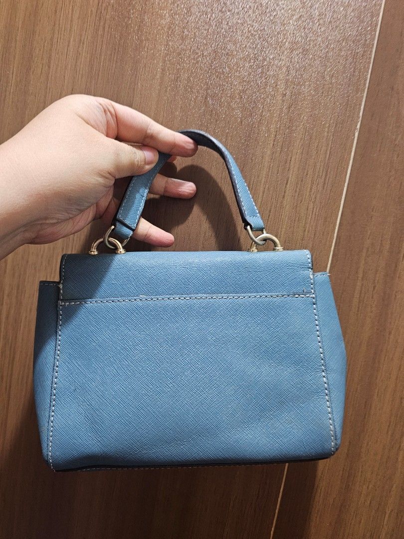 Michael Kors Mini 2way bag (Category: Shoulder Bags) located in Manila. Submitted by shopaholicmimi (Listing ID 1464476391, Image 2). Description: preloved and in good condition saffiano rare, not legacy, vintage, coach, ergo, laurel, carly, zoe, soho, y2k.