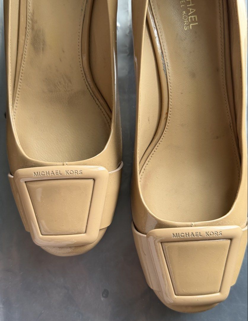 Michael Kors Patent Leather Block Heels (Category: Heels) located in Quezon City. Submitted by theblessedmars (Listing ID 1464371710, Image 2). Description: - Neutral beige/tan color - Stylish square toe - Decorative buckle detail on the front - Comfortable block heel - Soles show some slight signs of wear - Perfect for dressing up for an occasion or daily office wear - RFS : Decluttering.