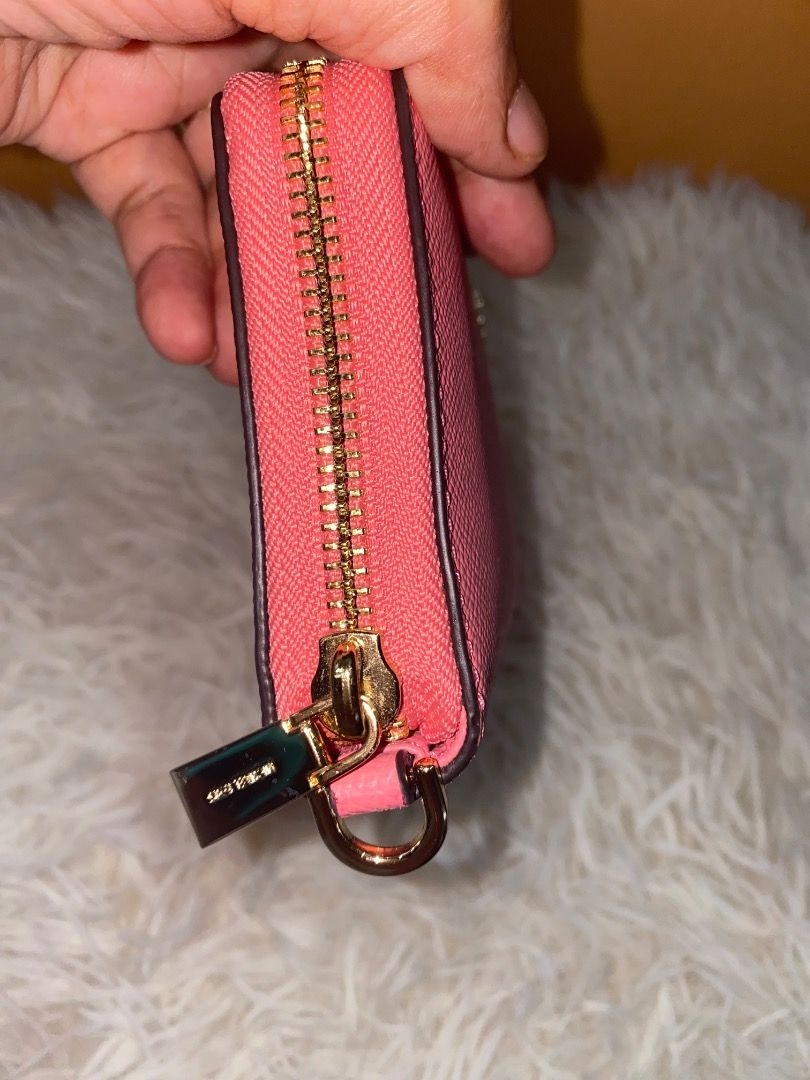Michael Kors Pink Saffiano Leather Wallet (Category: Wallets & Card holders) located in Lapu Lapu. Submitted by wenabeauty2026 (Listing ID 1464394176, Image 3). Description: - Authentic Pink Michael Kors Wallet - Genuine Saffiano Leather - Spacious interior for cards and cash - Perfect for everyday use - In good, pre-loved condition -US🇺🇸 Pre owned -color Is coral reef.
