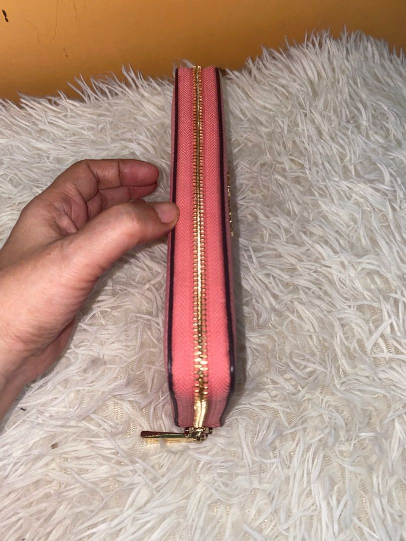 Michael Kors Pink Saffiano Leather Wallet (Category: Wallets & Card holders) located in Lapu Lapu. Submitted by wenabeauty2026 (Listing ID 1464394176, Image 2). Description: - Authentic Pink Michael Kors Wallet - Genuine Saffiano Leather - Spacious interior for cards and cash - Perfect for everyday use - In good, pre-loved condition -US🇺🇸 Pre owned -color Is coral reef.