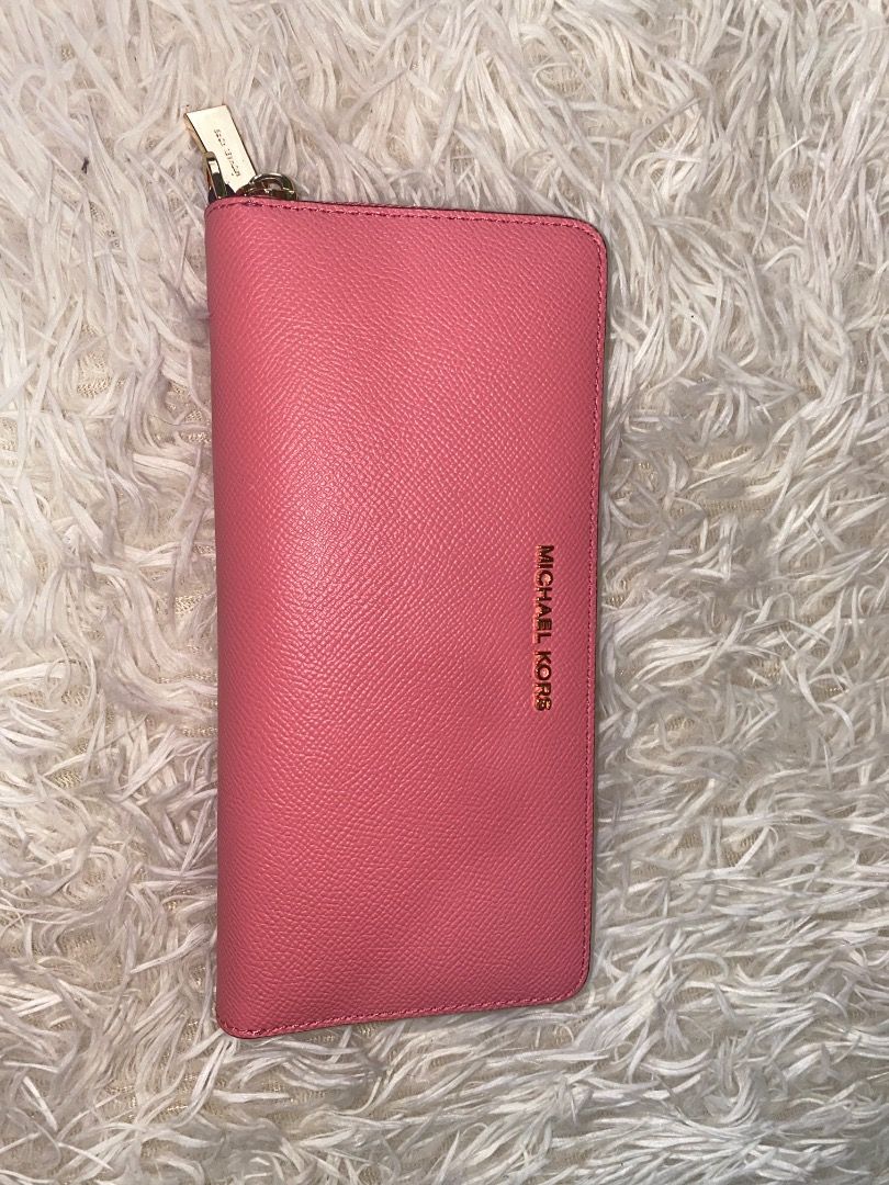 Michael Kors Pink Saffiano Leather Wallet (Category: Wallets & Card holders) located in Lapu Lapu. Submitted by wenabeauty2026 (Listing ID 1464394176, Image 1). Description: - Authentic Pink Michael Kors Wallet - Genuine Saffiano Leather - Spacious interior for cards and cash - Perfect for everyday use - In good, pre-loved condition -US🇺🇸 Pre owned -color Is coral reef.