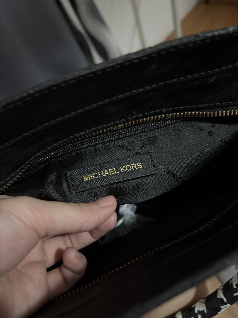 Michael Kors Saffiano Dillon Satchel (Category: Luxury Bags & Wallets) located in Paranaque City. Submitted by thisisbuttercup (Listing ID 1464541676, Image 2). Description: - Michael Kors satchel bag - Stylish two-tone beige and black design - Elegant gold hardware details - Functional interior with zip pocket and compartments - Comfortable top handles with a decorative scarf tie - Includes a replaced detachable shoulder strap for versatile wear
