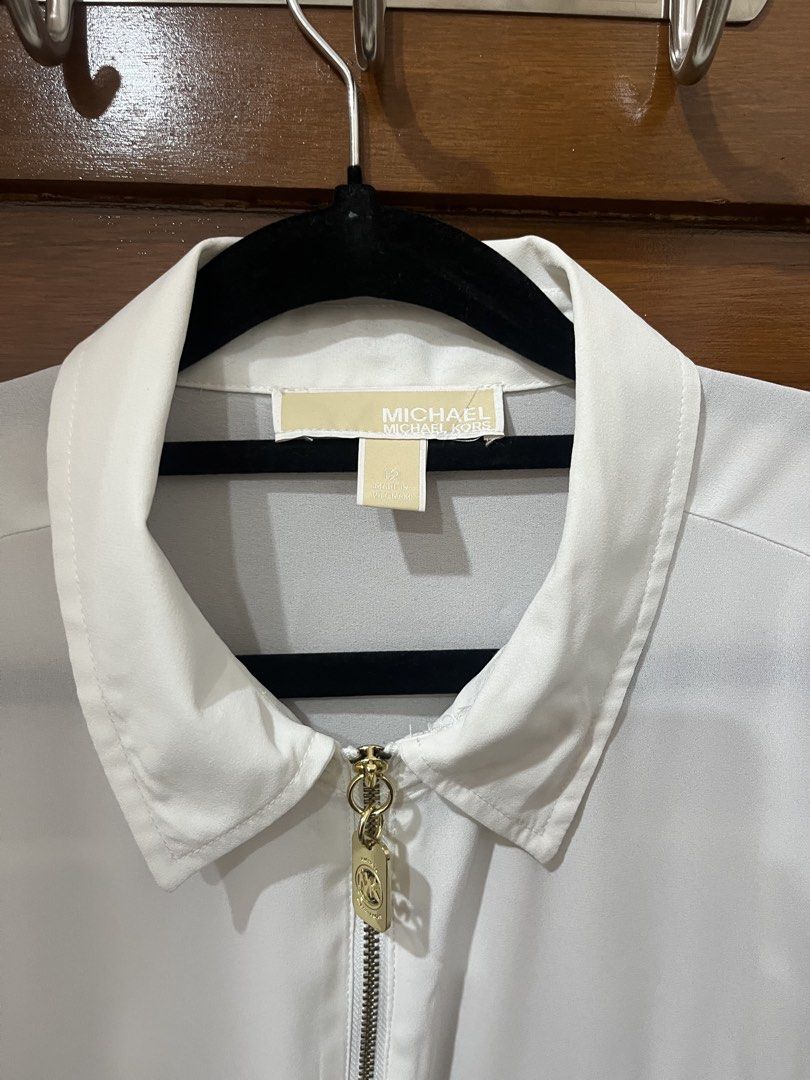 Michael Kors White Zip Up Shirt (Category: Longsleeves) located in Manila. Submitted by bbhzl (Listing ID 1464400787, Image 2). Description: - White Michael Kors long-sleeved shirt - Light blemish on the sleeve.
