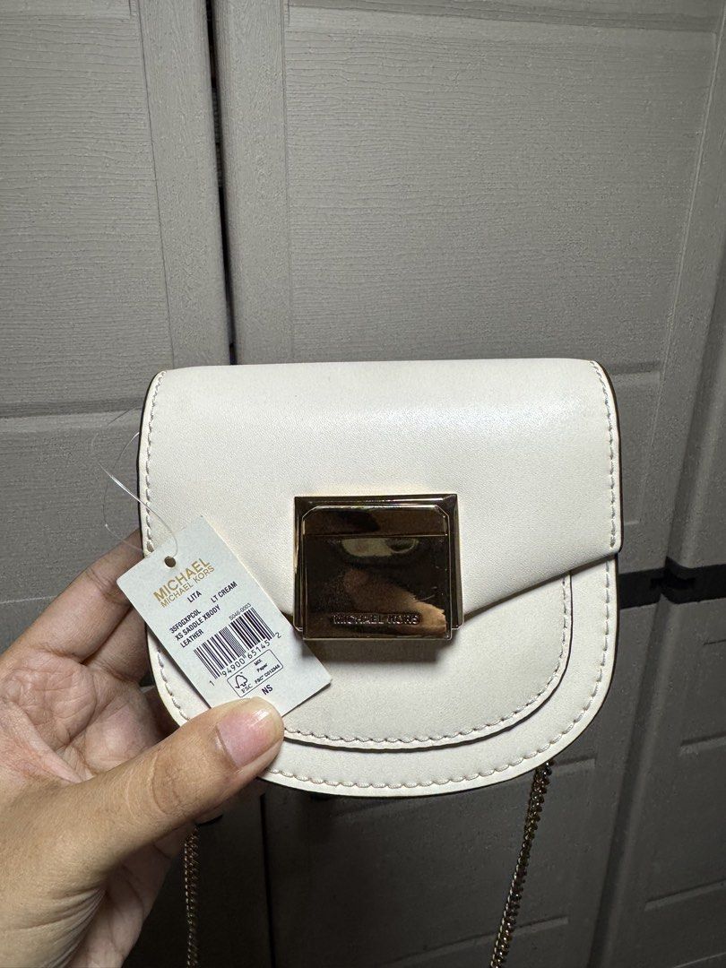 Michael Kors Xs Sling Bag (Category: Cross-body Bags) located in Manila. Submitted by nicoleaure20 (Listing ID 1464483687, Image 1). Description: brand new with tag :) after buying natambak na after hehe in good condition pa! - location: sampaloc, manila - mop: gcash/bpi - can be shipped thru lalamove/grab/ toktok/j&t but the buyer should shoulder the fee :) .