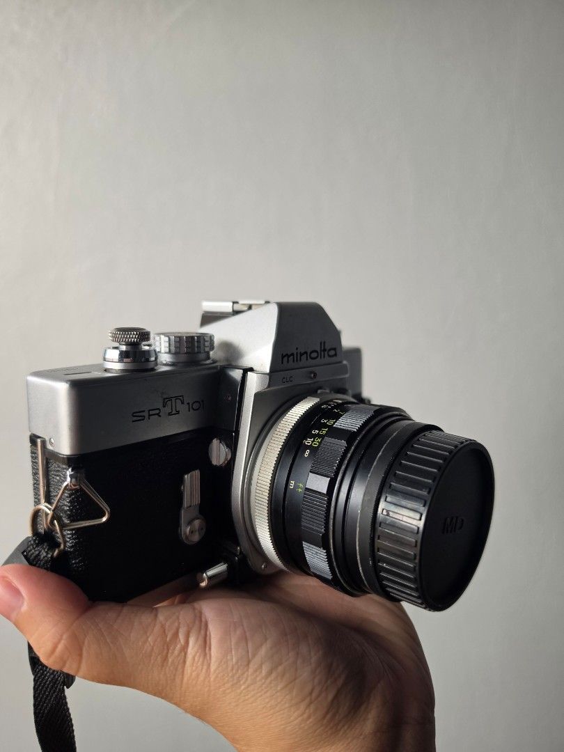 Minolta SRT 101 35mm Film Camera (Category: Cameras) located in Manila. Submitted by jaycy_ (Listing ID 1464379209, Image 2). Description: Minolta SRT 101 film camera - Classic silver and black body - Buy as is - Has not been CLA'd in 2 years. Working well last i used it. See photos for the sample shots - Minor dust in the view finder. - Free CaseLogic Bag and Lens brush/blower - Negotiable but no lowballing please ISSUE - Battery Cap cover is mi