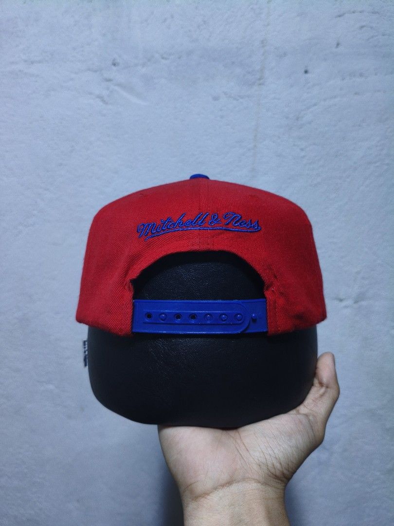Mitchell & Ness Washington Bullets Snapback Cap (Category: Caps & Hats) located in Malilipot. Submitted by aronbigorn96320 (Listing ID 1464470329, Image 2). Description: - Mitchell & Ness Washington Bullets snapback cap - Classic red and blue colorway - Features embroidered 'Bullets' logo on front - 'Mitchell & Ness' embroidered on the back - NBA logo detail on the side - Adjustable snapback closure for a custom fit - Ideal for any Washington Bul