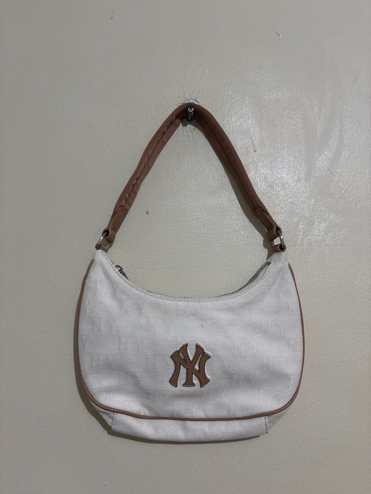 MLB NY Yankees Monogram Hobo bag (Category: Shoulder Bags) located in Muntinlupa City. Submitted by owrayttttt (Listing ID 1464458402, Image 1). Description: - MLB NY Yankees Monogram Hobo bag - 9 inches length, 5 inches height - No issue, just needs minor cleaning - Free shipping via j&t.