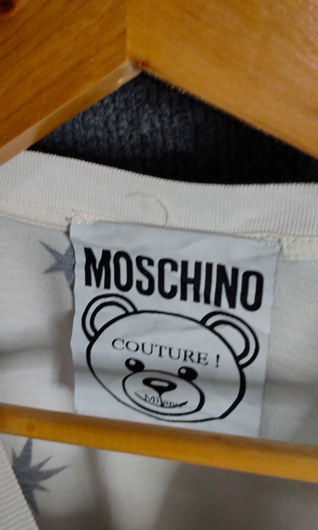 Moschino (Category: Tshirts & Polo Shirts ) located in Bolinao. Submitted by tokiya. (Listing ID 1464403348, Image 3). Description: Moschino Size Large 21.5x28 (minor yellow stain, not noticeable).