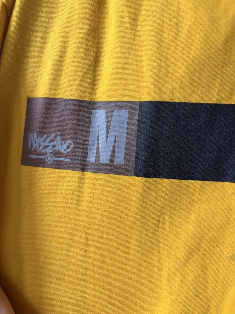 Mossimo long sleeves (Category: Tshirts & Polo Shirts ) located in Las Pinas. Submitted by bibliomomma (Listing ID 1464375908, Image 3). Description: Authentic Mossimo Inc. longsleeve graphic shirt featuring a bold mustard yellow and dark colorblock design with chest branding. Crafted from comfortable 100% cotton material in a relaxed fit. Well maintained preloved condition with no major flaws, perfect for streetwear or casual everyday style Pit 