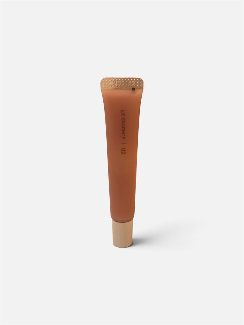 Muji Absolute Lip Essence | 02 (Category: Makeup) located in Makati City. Submitted by closetkkk (Listing ID 1464447673, Image 1). Description: - Muji Lip Essence - Shade: 02 - Type: Hydrating lip treatment - Packaging: Convenient squeeze tube with cap - Color: Warm, translucent brown - Benefit: Keeps lips moisturized throughout the day - Original Price 350.