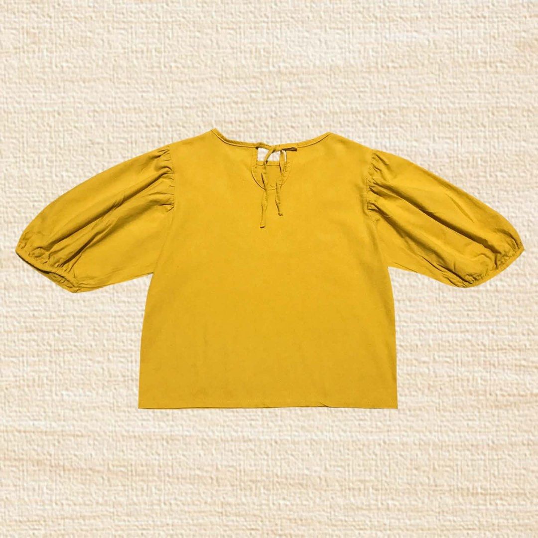 Mustard Yellow Puff Sleeve Top (Category: Blouses) located in Manila. Submitted by junebugexpress (Listing ID 1464518781, Image 2). Description: Unused, like new! This item is fitted on a dress form/mannequin. Standard size of dress form is small. 🌪️ MEASUREMENT 🌪️ Small-Medium Length: 20* Width: 19* Pit-to-pit: 19* *measured in inches *measured while laid flat.