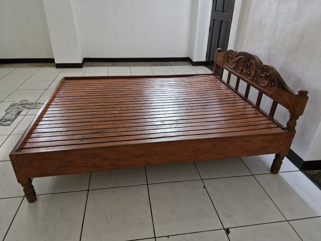 Narra Bed Frame (Category: Bed Frames & Mattresses) located in Meycauayan. Submitted by kookiesandv (Listing ID 1464404465, Image 3). Description: Pre-loved bed frame made out of narra wood Super durable and has already been in the family for a decade. Reason for selling: Moving out and decluttering; will be moving to a smaller place so can't bring the bed frame with me PM for more information :).