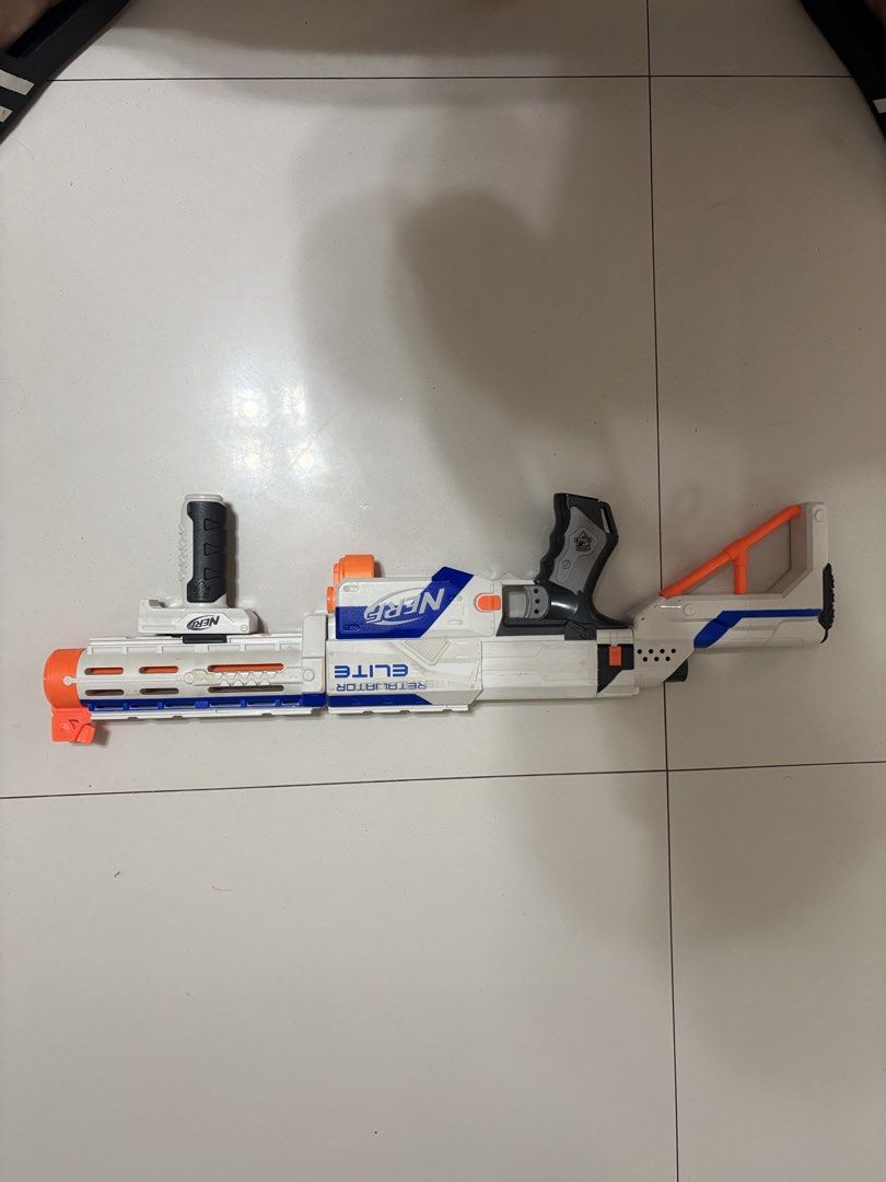 Nerf Elite Retaliator Blaster Toy Gun (Category: Action & Battle Toys) located in Taytay. Submitted by justinqt (Listing ID 1464387515, Image 2). Description: - White and blue Nerf Elite Retaliator blaster - Includes front barrel attachment - Includes stock - Features a removable handle - Great for play or collection - Ready for action!.