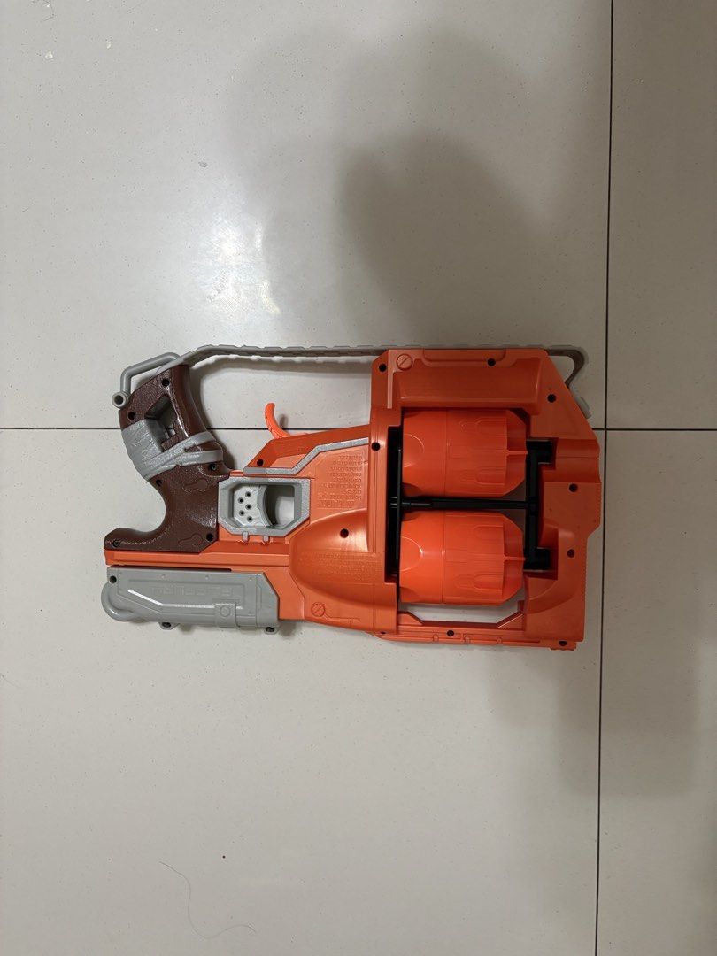 Nerf FlipFury Toy Gun (Category: Action & Battle Toys) located in Taytay. Submitted by justinqt (Listing ID 1464387438, Image 2). Description: - Orange and grey Nerf toy gun - Features two rotating barrels - Perfect for playtime fun - Minor scuff marks visible on the body - Ready for its next adventure!.