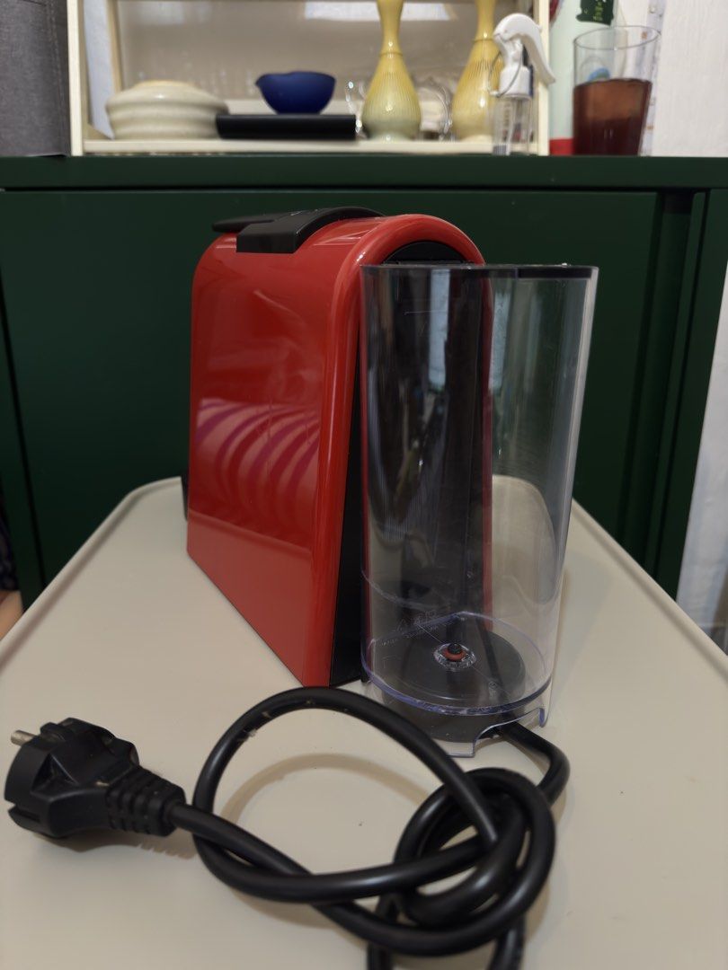 Nespresso Essenza Mini Red Coffee Machine (Category: Coffee Machines & Makers) located in Quezon City. Submitted by gellydgaf (Listing ID 1464459725, Image 3). Description: - Red Nespresso Essenza Mini coffee machine - Compact and easy to use - Perfect for quick espresso shots - Comes with a used capsule holder - Power cord included - Works well - With nespresso organizer RFS: Not using it anymore.