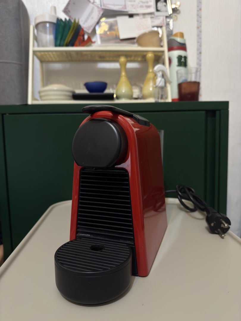 Nespresso Essenza Mini Red Coffee Machine (Category: Coffee Machines & Makers) located in Quezon City. Submitted by gellydgaf (Listing ID 1464459725, Image 1). Description: - Red Nespresso Essenza Mini coffee machine - Compact and easy to use - Perfect for quick espresso shots - Comes with a used capsule holder - Power cord included - Works well - With nespresso organizer RFS: Not using it anymore.