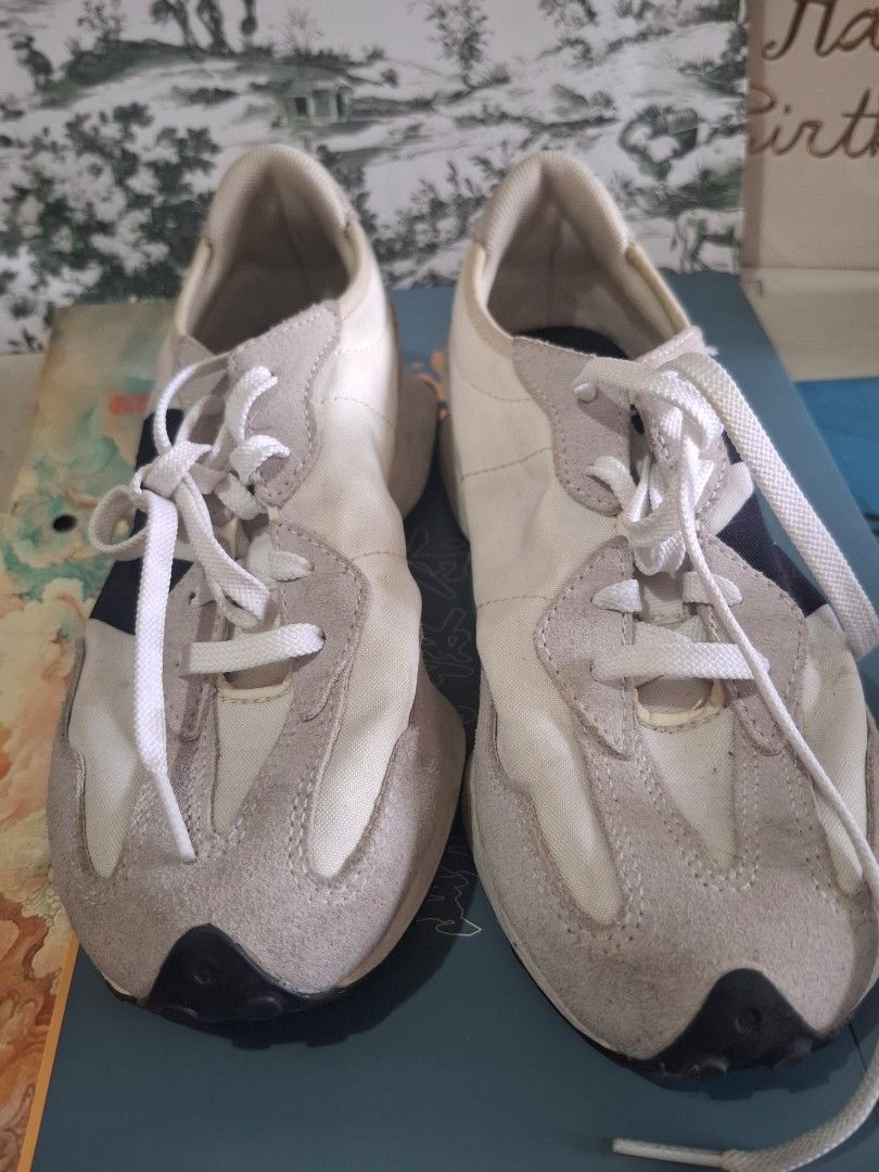 New Balance 327 Sneakers (Category: Sneakers) located in Marikina City. Submitted by bags21.ph (Listing ID 1464371069, Image 1). Description: - Brand New Balance - Model 327 - Colorway: Classic Off-White and Grey - Features iconic 'N' logo on the side - Perfect for casual everyday wear.