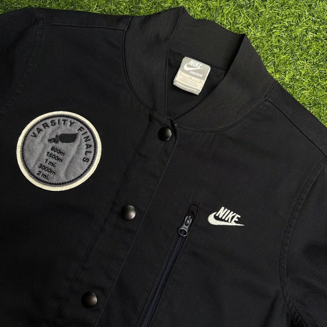 Nike | Varsity Jacket. (Category: Coats, Jackets and Outerwear) located in Manila. Submitted by bypiecesandstories (Listing ID 1464480006, Image 3). Description: Nike | Varsity Jacket. 649 PHP 🧡 Perfect Condition Can Fit — X Small to Small Dimensions — W 18" L 25" A classic Nike varsity jacket with “Determine to Dominate” embroidered on the left sleeve. Versatile and easy to style, it’s a great statement layer for everyday looks. • REMINDERS • —