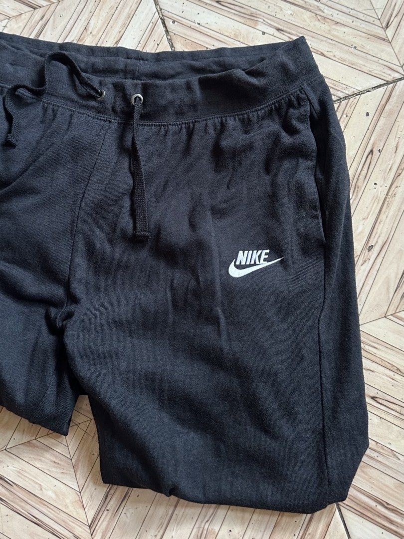 Nike Black Jogger Sweatpants Size L (Category: Joggers) located in Angeles City. Submitted by alejeong27 (Listing ID 1464388123, Image 3). Description: - Black Nike sweatpants - Jogger style with cuffed ankles - Elastic waistband with adjustable drawstring - Two convenient side pockets - Subtle Nike logo on the left leg - Ideal for lounging and casual wear - Made in China.