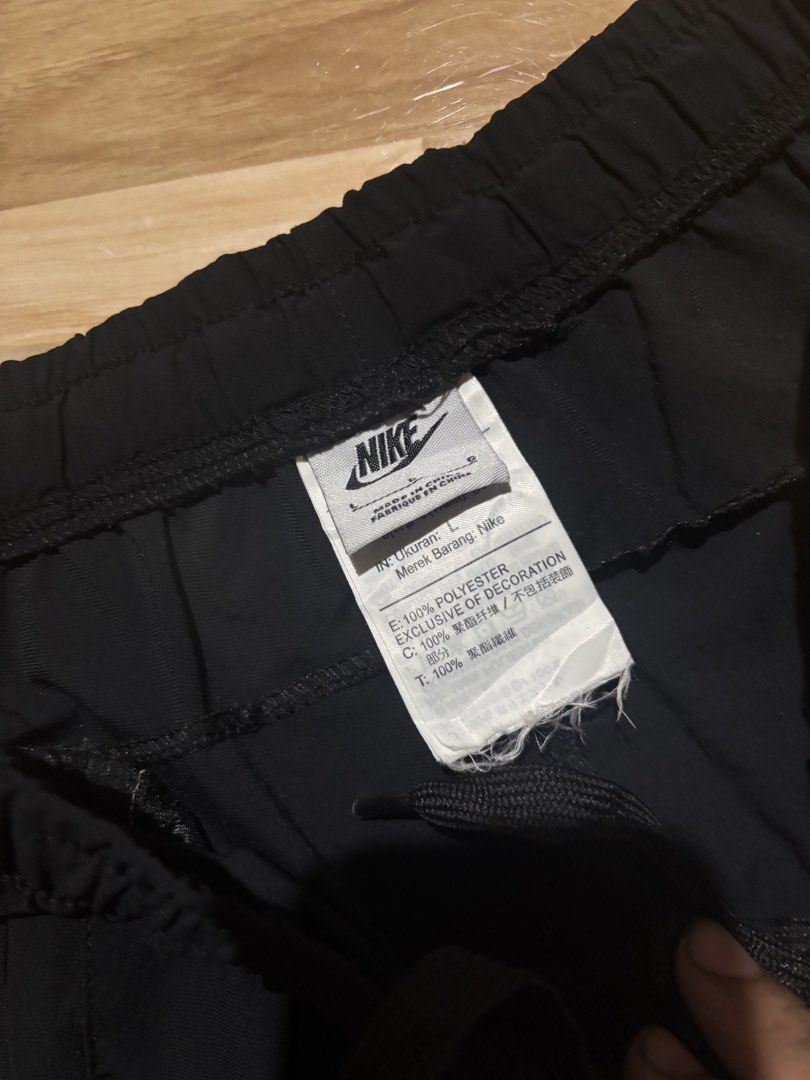 Nike Black Polyester Shorts Size L (Category: Shorts) located in Tubigon. Submitted by wawiesunbe75372 (Listing ID 1464458587, Image 2). Description: - Black Nike Shorts - Size: L - Material: 100% Polyester - Features: Elastic waistband with drawstring, two side pockets - Ideal for: Sports or casual wear - Note: Please check measurements in photos.