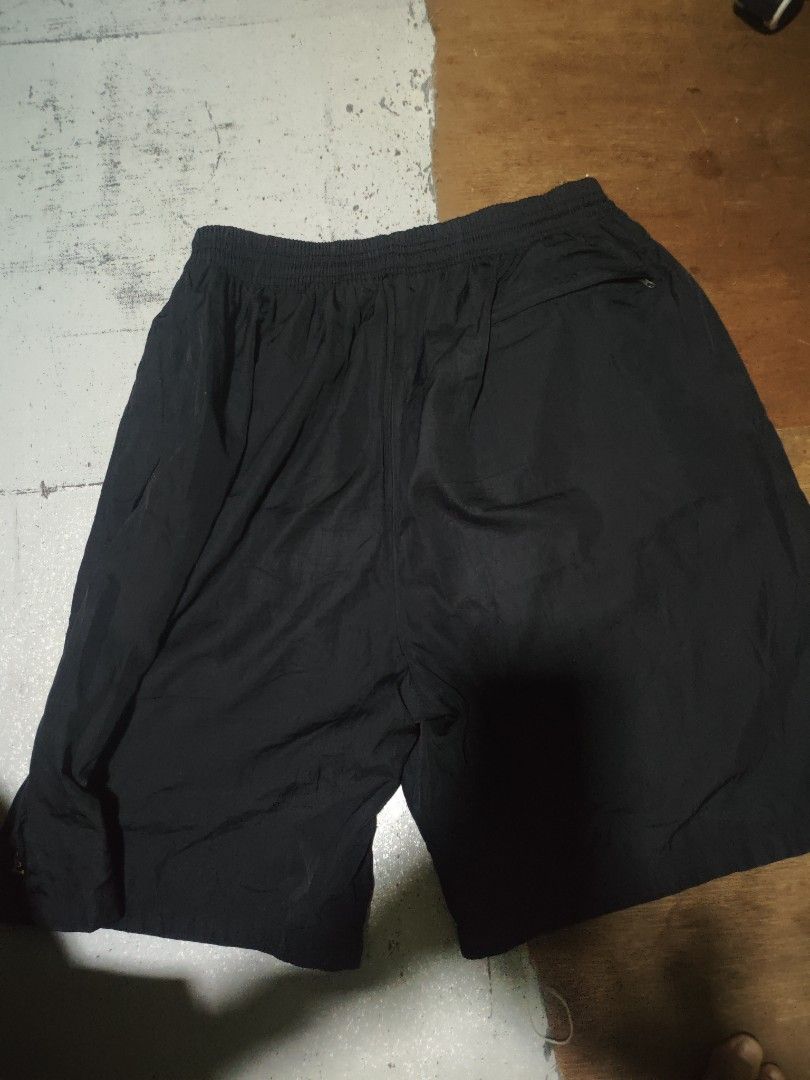 Nike Black Running Shorts (Category: Shorts) located in Manila. Submitted by jb.ukay (Listing ID 1464468091, Image 2). Description: - Black Nike shorts - Features Nike logo on left leg - 'NIKE' text on right hem - Elastic waistband for a comfortable fit - Ideal for workouts or casual wear.