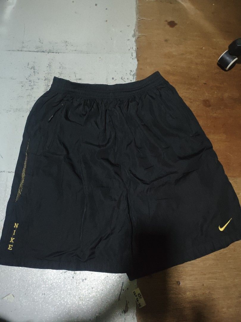 Nike Black Running Shorts (Category: Shorts) located in Manila. Submitted by jb.ukay (Listing ID 1464468091, Image 1). Description: - Black Nike shorts - Features Nike logo on left leg - 'NIKE' text on right hem - Elastic waistband for a comfortable fit - Ideal for workouts or casual wear.
