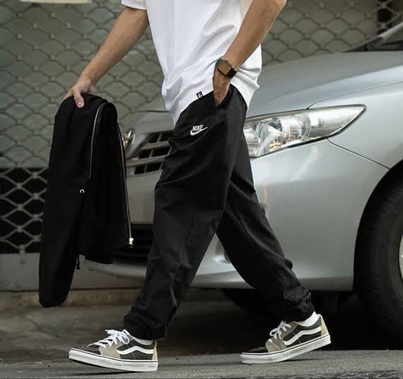 Nike Black Track Pants Joggers (Category: Joggers) located in Badiangan. Submitted by iralorana.thrift (Listing ID 1464466821, Image 1). Description: - Black Nike track pants - Elastic waistband with drawstring - Cuffed ankles - Two side pockets - Simple Nike logo on the left thigh - Ideal for casual wear or sports.