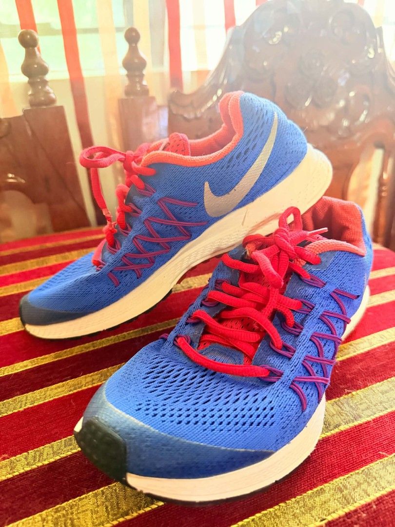 Nike Blue and Red Running Shoes (Category: Sneakers) located in Manila. Submitted by nel_besario.1992 (Listing ID 1464438246, Image 1). Description: - Blue Nike running shoes - Features red laces and accents - Breathable mesh upper - Lightweight sole for comfort - Ideal for running workouts or casual wear - Ready for your next adventure!.