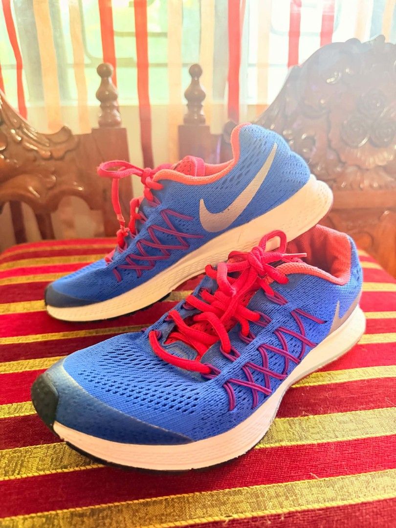 Nike Blue and Red Running Shoes (Category: Sneakers) located in Manila. Submitted by nel_besario.1992 (Listing ID 1464438246, Image 2). Description: - Blue Nike running shoes - Features red laces and accents - Breathable mesh upper - Lightweight sole for comfort - Ideal for running workouts or casual wear - Ready for your next adventure!.