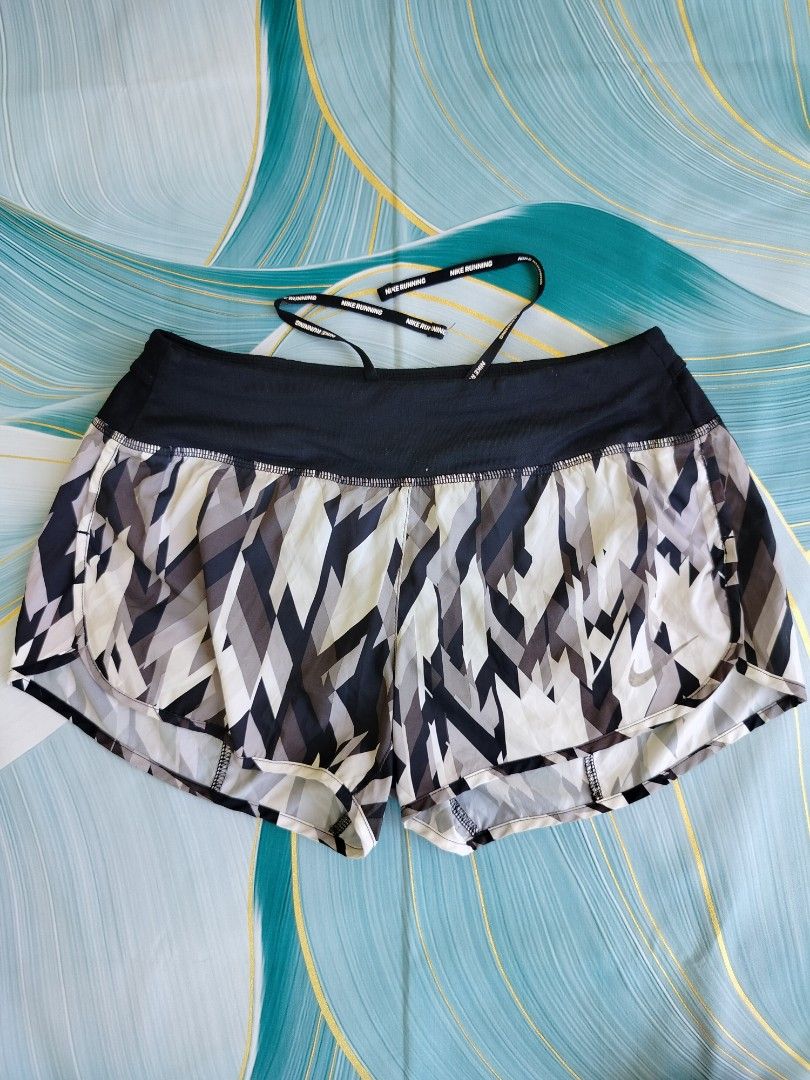 Nike Dri-Fit Running Shorts (Category: Activewear) located in Manila. Submitted by virgiliosa38485 (Listing ID 1464495746, Image 1). Description: - Nike Dri-Fit running shorts -Waist 28-34 - Cool abstract print - Keeps you dry with Dri-Fit technology - Drawstring waist for adjustable fit - Small zippered pocket at the back - Ideal for running, workouts, or everyday casual wear.