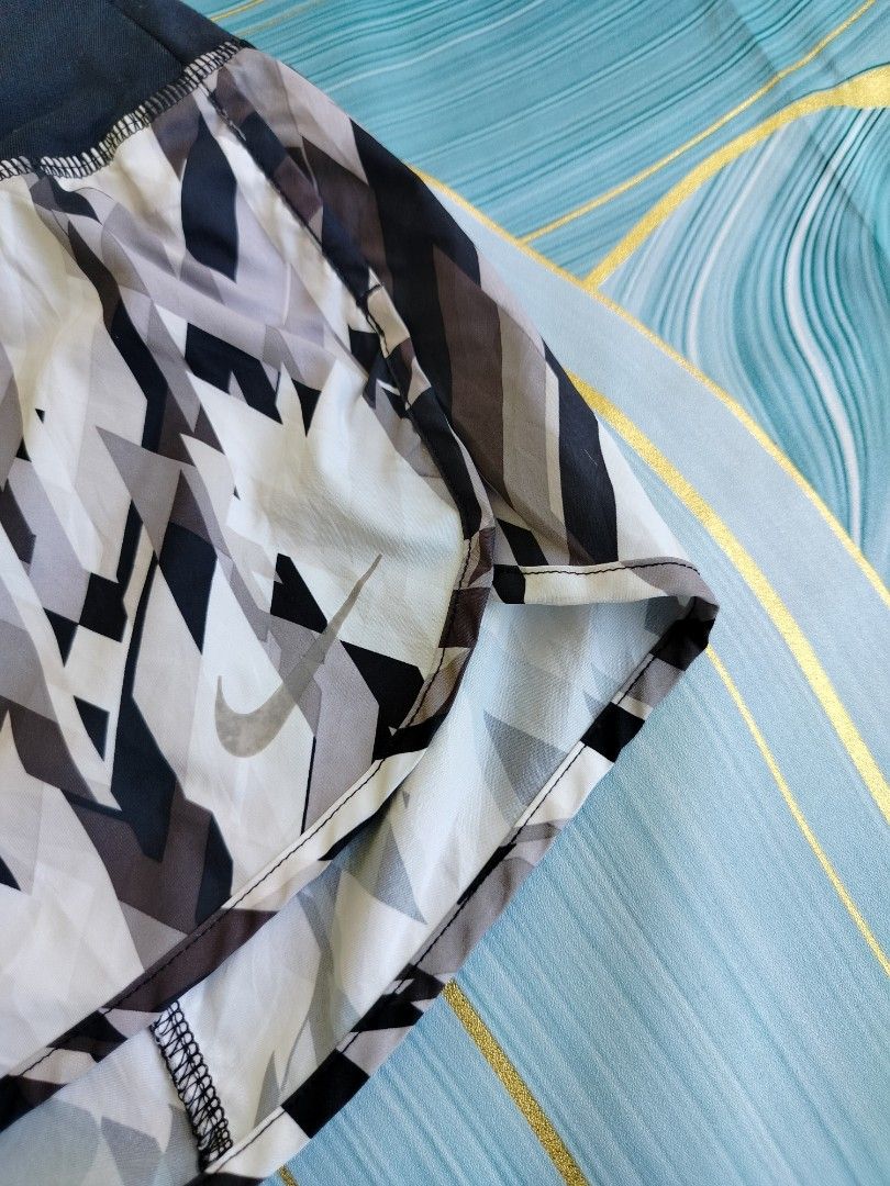 Nike Dri-Fit Running Shorts (Category: Activewear) located in Manila. Submitted by geraldquinto_917 (Listing ID 1464507369, Image 2). Description: - Nike Dri-Fit running shorts -Waist 28-34 - Stylish geometric pattern - Convenient back zip pocket for essentials - Adjustable drawstring for a secure fit - Ideal for running, workouts, and active wear.