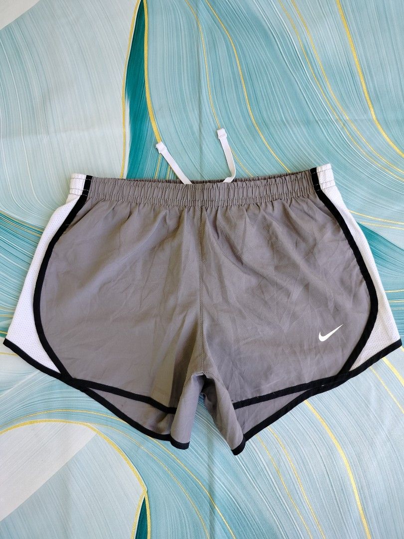 Nike Dri-Fit Running Shorts Grey Size M (Category: Activewear) located in Manila. Submitted by virgiliosa38485 (Listing ID 1464494796, Image 1). Description: - Grey Nike running shorts - Size Medium -Waist 24-30 - Features Nike swoosh logo - Dri-Fit technology for sweat-wicking - Elastic waistband with drawstring - Ideal for workouts and casual wear.