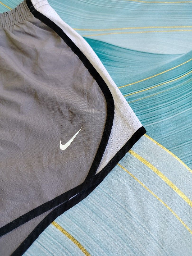Nike Dri-Fit Running Shorts Grey Size M (Category: Activewear) located in Manila. Submitted by virgiliosa38485 (Listing ID 1464494796, Image 2). Description: - Grey Nike running shorts - Size Medium -Waist 24-30 - Features Nike swoosh logo - Dri-Fit technology for sweat-wicking - Elastic waistband with drawstring - Ideal for workouts and casual wear.
